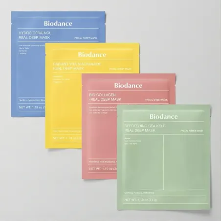 4 masques visage differents (vert, rouge, jaune et bleu) de biodance a plat, les uns sur les autres, sur un fond neutre